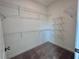 Walk-in closet featuring wire shelving, providing ample storage space for an organized wardrobe at 532 Healy Dr # 61, Cumming, GA 30040