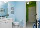 Charming blue bathroom with vanity, toilet, and walk in shower at 730 Jackson Miller Cir, Powder Springs, GA 30127