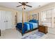 Comfortable bedroom with four-poster bed, side table, carpet and ample closet space at 730 Jackson Miller Cir, Powder Springs, GA 30127