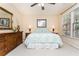 Cozy bedroom featuring a comfortable bed, neutral walls, and a ceiling fan for added comfort at 730 Jackson Miller Cir, Powder Springs, GA 30127