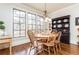 Bright dining room featuring hardwood floors, a large window and a chandelier at 730 Jackson Miller Cir, Powder Springs, GA 30127