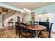 Formal dining room features an oval table, chandelier, and access to the foyer at 730 Jackson Miller Cir, Powder Springs, GA 30127