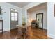 Elegant foyer with gleaming hardwood floors, a decorative table, and neutral paint, offering a welcoming ambiance at 730 Jackson Miller Cir, Powder Springs, GA 30127