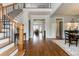 Spacious foyer with hardwood floors, staircase, and access to the dining room and living spaces at 730 Jackson Miller Cir, Powder Springs, GA 30127