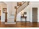 Grand foyer featuring hardwood floors, decorative staircase, and elegant decor at 730 Jackson Miller Cir, Powder Springs, GA 30127