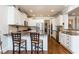Eat-in kitchen featuring granite countertops, white cabinets, and stainless steel appliances at 730 Jackson Miller Cir, Powder Springs, GA 30127