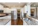 Gourmet kitchen features granite countertops, stainless steel appliances, and ample cabinet space at 730 Jackson Miller Cir, Powder Springs, GA 30127