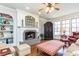 Inviting living room features a fireplace, built-in shelves, and large windows for natural light at 730 Jackson Miller Cir, Powder Springs, GA 30127