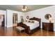 Spacious bedroom with hardwood floors, king-size bed, and ensuite bathroom access at 730 Jackson Miller Cir, Powder Springs, GA 30127