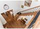 Well-lit staircase with hardwood steps and a decorative wrought iron railing at 730 Jackson Miller Cir, Powder Springs, GA 30127