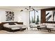 Stylish bedroom with wood accents, chic lighting, and a comfortable seating area with large windows at 2380 Greenglade Ne Rd, Atlanta, GA 30345
