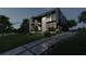 Modern home exterior at dusk, showcasing sleek design and professional landscaping at 2380 Greenglade Ne Rd, Atlanta, GA 30345