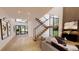 Staircase foyer with minimalist artwork, high ceilings, hardwood floors, and lots of natural light at 2380 Greenglade Ne Rd, Atlanta, GA 30345