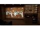 Stylish home theater setup with modern bar and wine fridge for ultimate entertainment at 2380 Greenglade Ne Rd, Atlanta, GA 30345