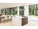 Bright, spacious kitchen and dining room with modern countertops and floor-to-ceiling windows at 2380 Greenglade Ne Rd, Atlanta, GA 30345
