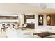 Open concept living space with a modern kitchen, dining area, and elegant living room at 2380 Greenglade Ne Rd, Atlanta, GA 30345