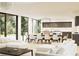 Spacious living room with modern furniture, chandelier, and open floor plan at 2380 Greenglade Ne Rd, Atlanta, GA 30345