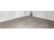 Spacious carpeted bedroom featuring neutral walls, doors and white trim at 3699 Broadwick Ln, Lithonia, GA 30038