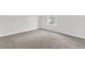 Carpeted bedroom with a bright window and neutral walls at 3699 Broadwick Ln, Lithonia, GA 30038