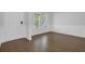 Welcoming entryway with beautiful hardwood floors, fresh paint, and wainscoting at 3699 Broadwick Ln, Lithonia, GA 30038