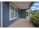 Inviting front porch with classic white columns and a view of the surrounding neighborhood at 3699 Broadwick Ln, Lithonia, GA 30038