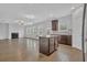 Modern kitchen area offers stainless steel appliances, ample counter space, and a beautiful wood floor at 3699 Broadwick Ln, Lithonia, GA 30038