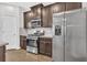 Bright kitchen features stainless steel appliances, granite counters, tile backsplash and ample cabinet space at 3699 Broadwick Ln, Lithonia, GA 30038