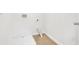 A compact laundry space featuring tiled floors and essential hookups at 3699 Broadwick Ln, Lithonia, GA 30038