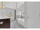 Main bathroom featuring dual vanity, bathtub and tiled shower at 3699 Broadwick Ln, Lithonia, GA 30038
