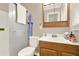 Bathroom with wood vanity, sink, and shower featuring glass doors at 4845 Willow St, Acworth, GA 30101