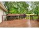 Wooden deck with black metal railing overlooking landscaped yard at 4845 Willow St, Acworth, GA 30101
