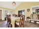 Sunlit dining area with tile floors, multiple windows, and traditional furnishings at 4845 Willow St, Acworth, GA 30101