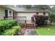 Inviting covered front porch with dark stained wood and mature plantings at 4845 Willow St, Acworth, GA 30101