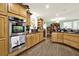 Gourmet kitchen featuring stainless steel appliances, granite countertops, and custom wood cabinets at 4845 Willow St, Acworth, GA 30101
