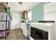 Bright laundry room with washer, dryer, and ample storage space and natural light at 4845 Willow St, Acworth, GA 30101