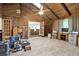 Spacious living room with wood paneling, vaulted ceilings, and ample natural light at 4845 Willow St, Acworth, GA 30101