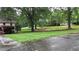 Lush, green lawn and mature shade trees surround the home at 4845 Willow St, Acworth, GA 30101