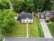 Aerial view of a home with a well-maintained lawn and a nearby house at 600 Delphinium Nw Blvd, Acworth, GA 30102