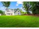 Spacious backyard with lush green grass and mature trees offers lots of privacy at 600 Delphinium Nw Blvd, Acworth, GA 30102