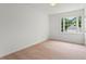 Bright, spacious bedroom with light wood floors, white walls, and a large window at 600 Delphinium Nw Blvd, Acworth, GA 30102