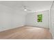 Bright bedroom with wood floors, neutral walls, a ceiling fan, and a window at 600 Delphinium Nw Blvd, Acworth, GA 30102