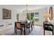 Inviting dining room features natural light, modern table setting, and contemporary decor at 600 Delphinium Nw Blvd, Acworth, GA 30102