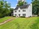 Charming two-story home with a well-manicured lawn and classic white facade at 600 Delphinium Nw Blvd, Acworth, GA 30102
