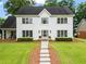 Beautiful home with well-maintained lawn and a walkway leading to the front door at 600 Delphinium Nw Blvd, Acworth, GA 30102