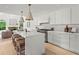 Gourmet kitchen features stone counters, a large island, stainless steel appliances, and seamless access to living area at 600 Delphinium Nw Blvd, Acworth, GA 30102