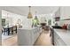 Gourmet kitchen with a large island, stainless steel appliances, and open access to the dining and living areas at 600 Delphinium Nw Blvd, Acworth, GA 30102