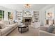 Cozy living room boasts a stone fireplace, built-in shelving, and comfortable seating at 600 Delphinium Nw Blvd, Acworth, GA 30102