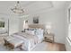 Well-lit main bedroom featuring a sitting area, neutral tones, and an ensuite bath at 600 Delphinium Nw Blvd, Acworth, GA 30102