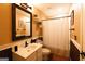 The quaint bathroom features a vanity with a white sink and a shower with white curtains at 8245 Mill Run Trl, Whitesburg, GA 30185