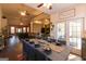 Inviting dining room features wood floors, stylish table setting and easy access to the outdoor deck at 8245 Mill Run Trl, Whitesburg, GA 30185